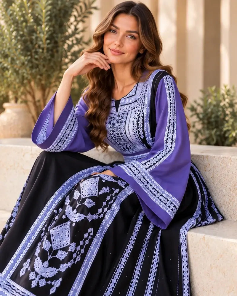 Elegant Embroidered Dress featuring traditional Jordanian-inspired embroidery and modern silhouette.